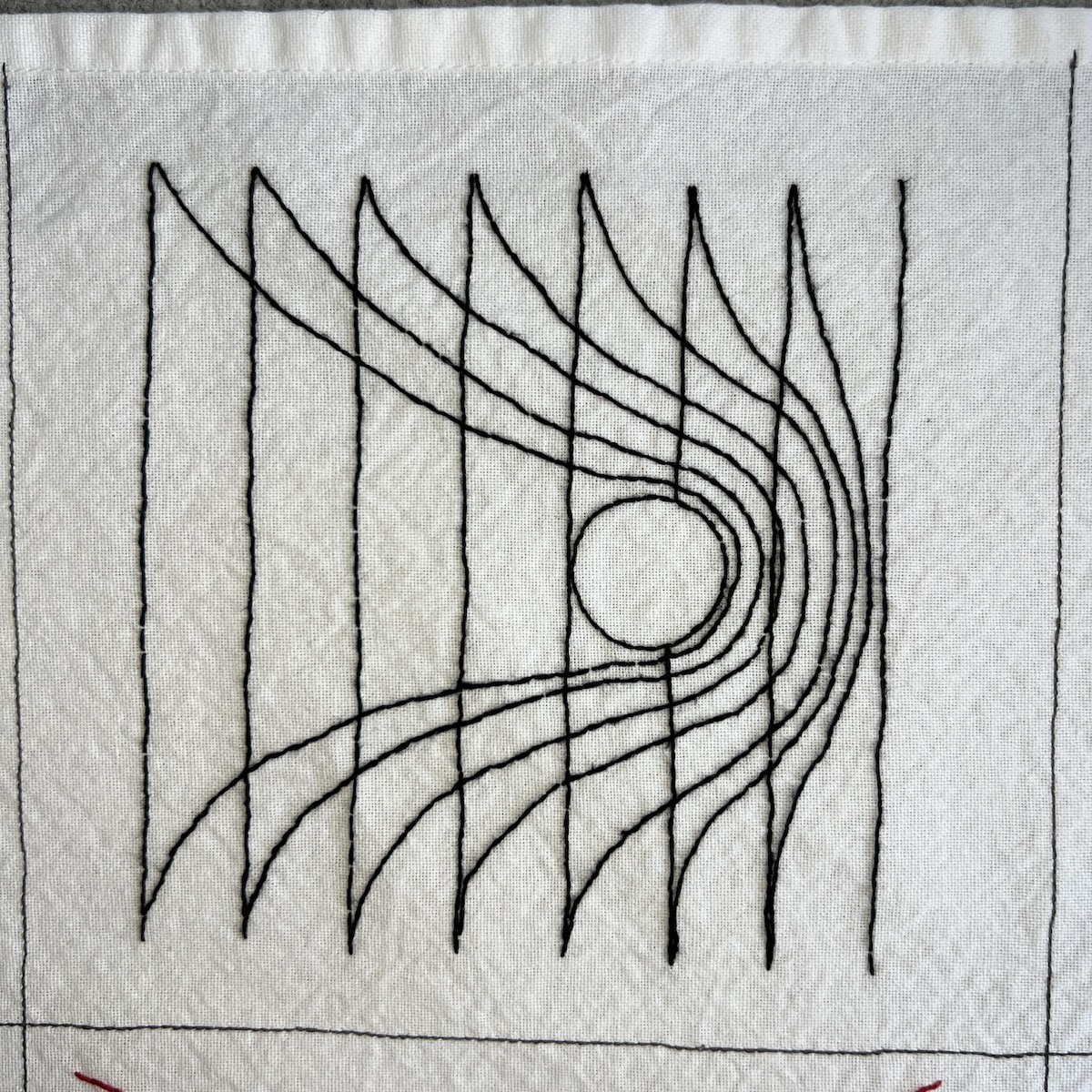 Overhead photo of white fabric 8”x8” square, with black embroidered lines. There are 8 vertical black lines dispersed across the square. A circle is in the middle of the square, giving the appearance of bending/pushing another set of 8 vertical lines to the right.