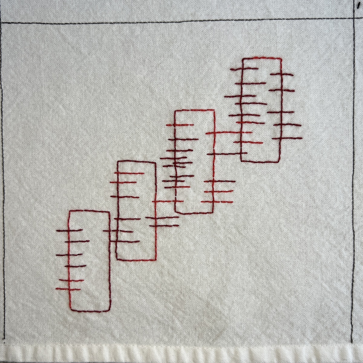 Overhead photo of white fabric 8”x8” square with 4 vertical rectangles ascending from left to right, stitched in red variegated thread. Each rectangle has an increasing number of short horizontal lines overlapping the long edges.